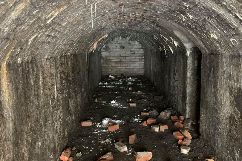 A sally port floor is littered with bricks at Fort Mitchel on Spike Island.