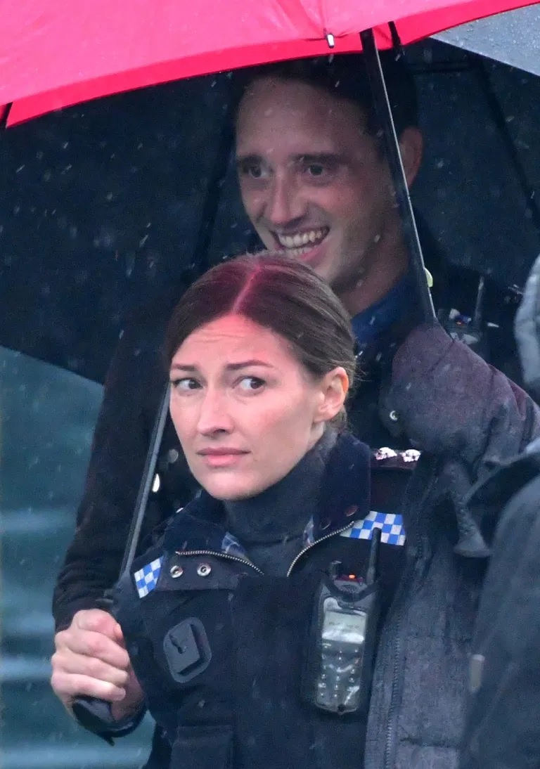 Kelly Macdonald braves the rain during filming for “Line of Duty”.
