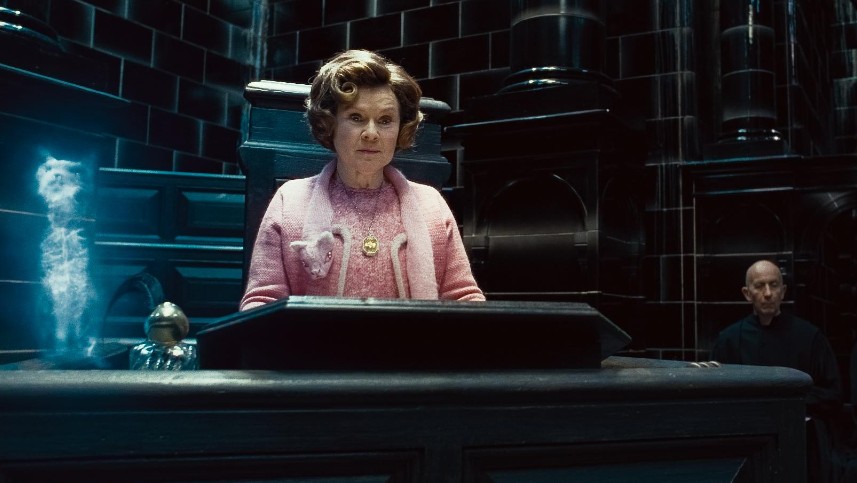 Dolores Umbridge is scary as she reigns from her pedestal in the Ministry of Magic, pritected by her patronus cat.