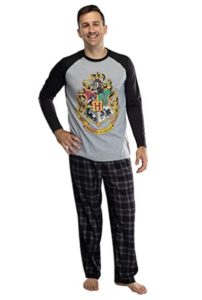 grey men's pajamas with Hogwarts crest are modeled