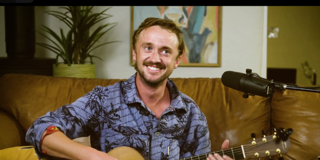 Tom Felton playing and singing at his home party.