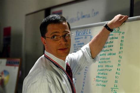 Will Bailey with a hand on a whiteboard