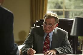 Jed Bartlet sitting at a desk