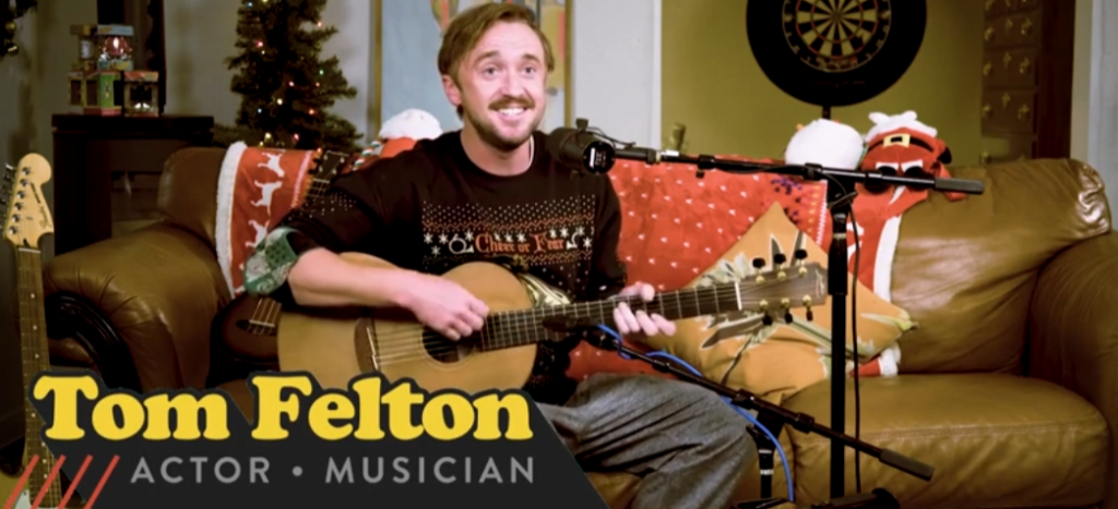 Felton shows off his musical skills for his Holiday Home Party. 