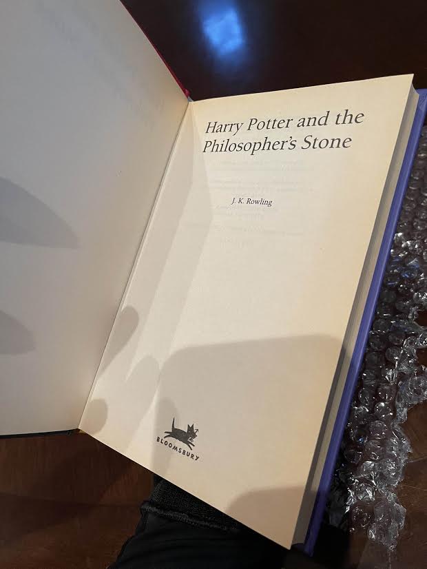 The title page of Jeremy Padawer’s copy of “Harry Potter and the Philosopher’s Stone” is shown.