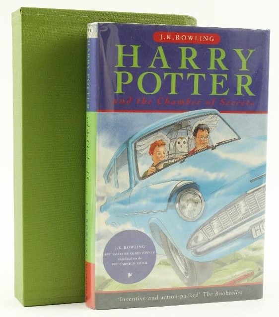 An original Bloomsbury edition of Chamber of Secrets is pictured with a green slipcase.