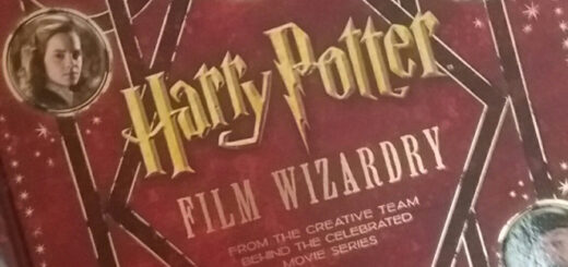 Red book cover with Harry, Ron and Hermione in circles around the words "Harry Potter Film Wizardry" in gold lettering