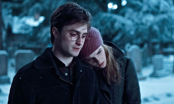 Hermione resting her head on Harry's shoulder in a cemetary