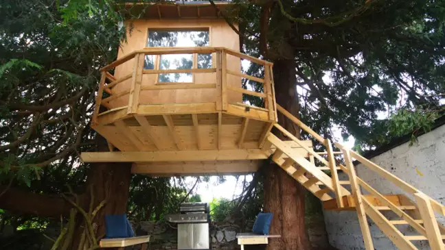 Draiocht Magic House, in Ireland, is a family-friendly rental getaway with a tree house for children to play in.