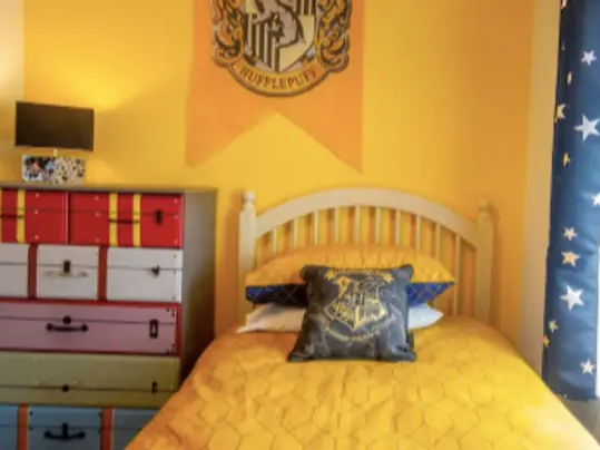 This bedroom in Draiocht Magic House in Ireland has a Hufflepuff color scheme.