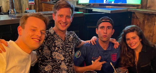 Matthew Lewis and All Creatures cast mates watching football.