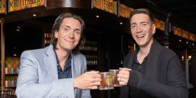 James and Oliver Phelps trying butterbeer at the "Harry Potter Photographic Exhibition"