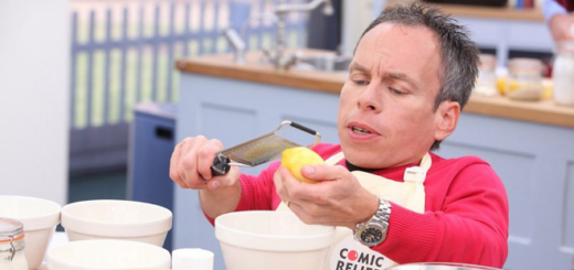 Warwick Davis is shown zesting a lemon in a 2013 promotional image for "The Great Comic Relief Bake Off."