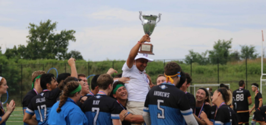 Head coach Juan Martinez raises the Benepe Cup, the league trophy named after quidditch founder Alex Benepe, as he is lifted into the air by his teammates. Photo by Mike Iadevaia