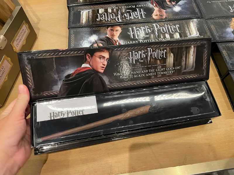 A Harry Potter wand from the Noble Collection that has an illuminating tip is shown as photographed by WDW News Today.