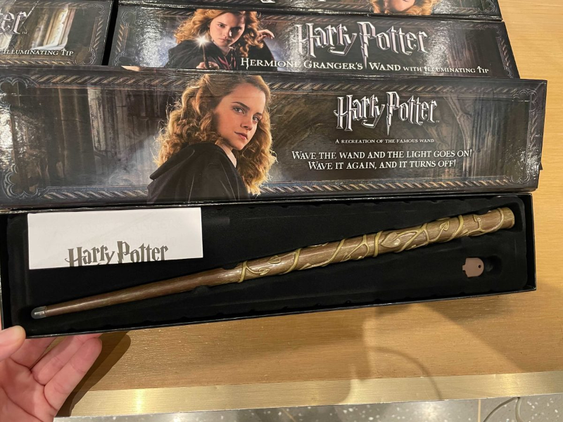 A Hermione Granger wand from the Noble Collection that has an illuminating tip is shown as photographed by WDW News Today.
