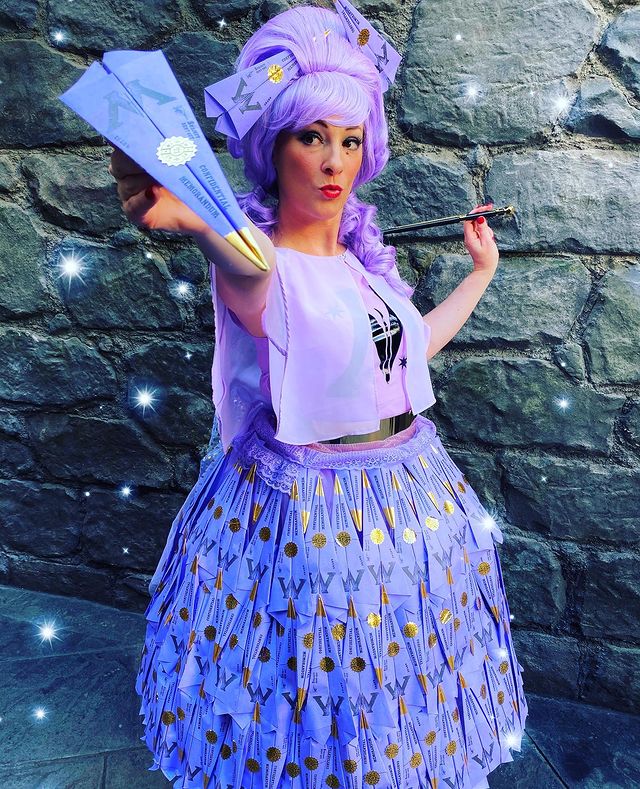 A fan shows off her costume: A dress made of purple Ministry of Magic Memos
