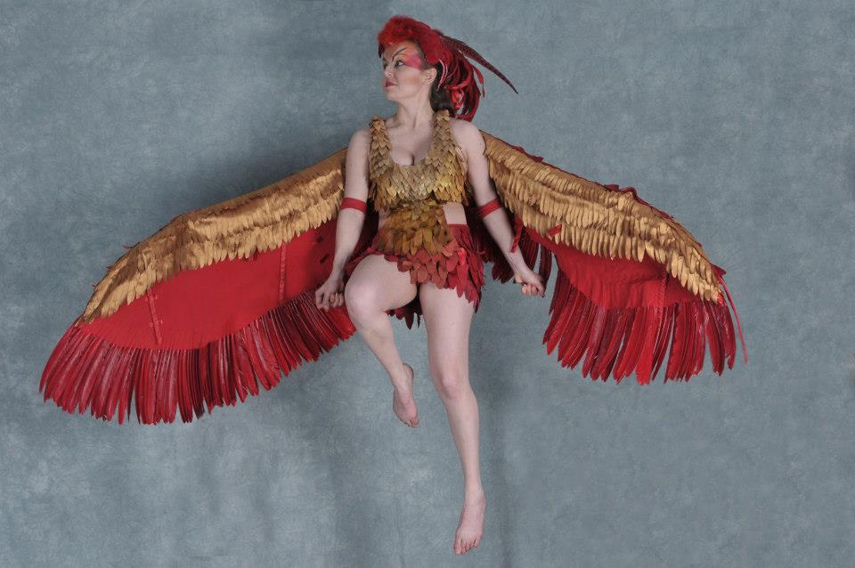 A fan poses in her Phoenix costume