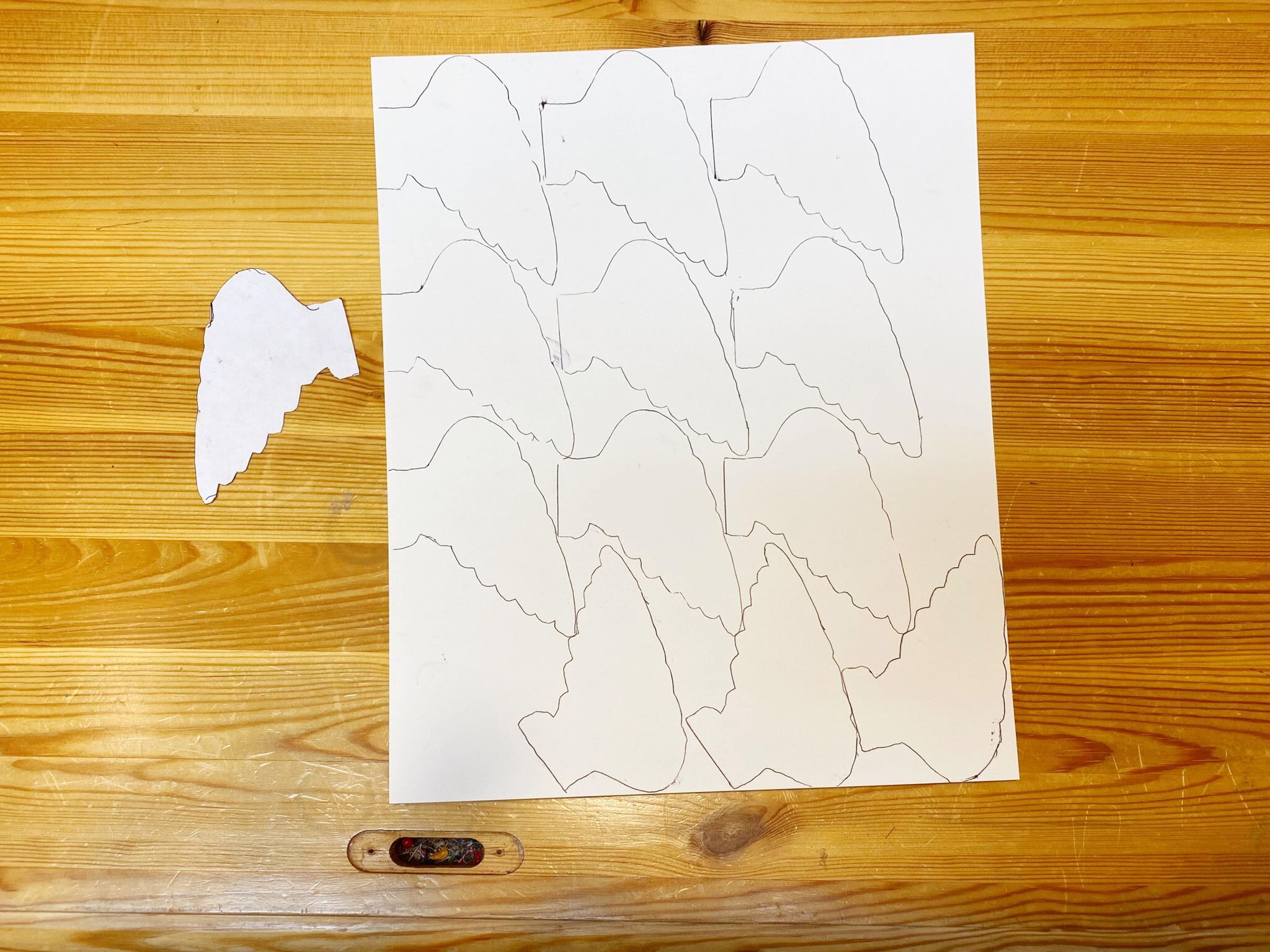 Trace your wings onto cardstock.