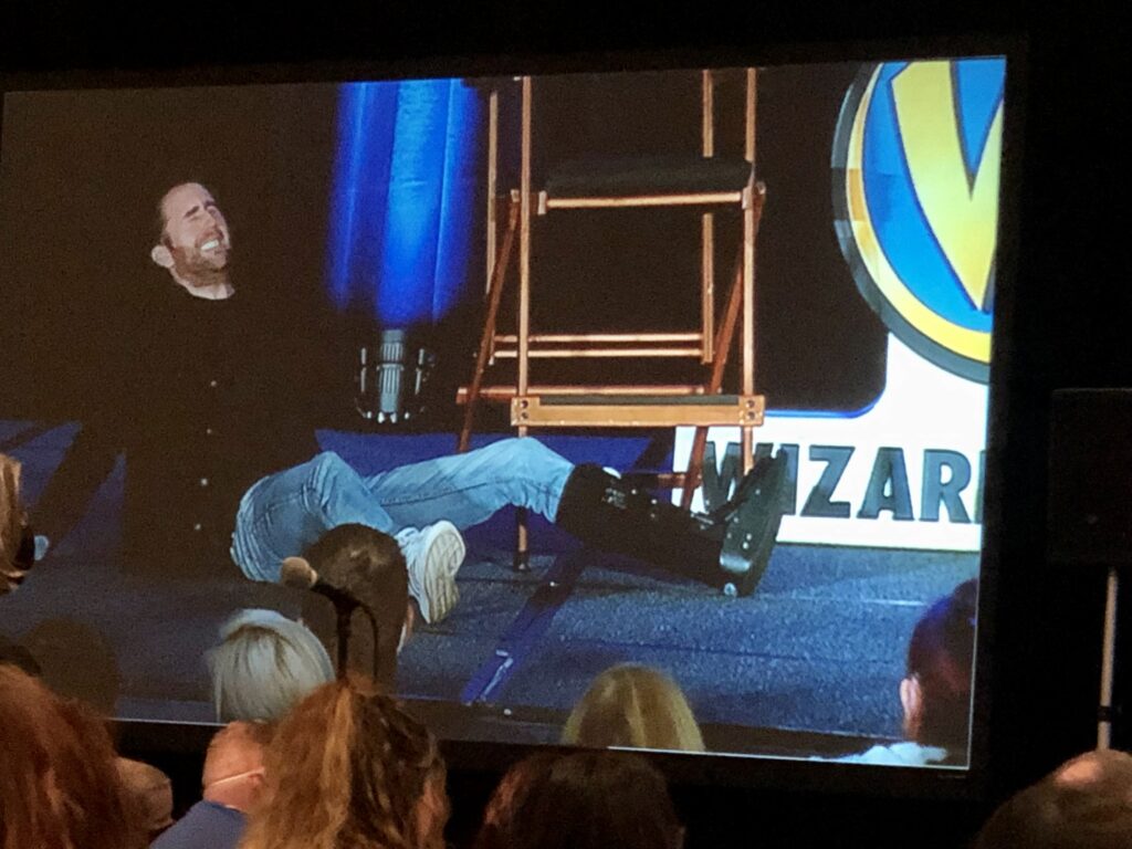 Matthew Lewis demonstrates a game played on set at Wizard World Chicago.