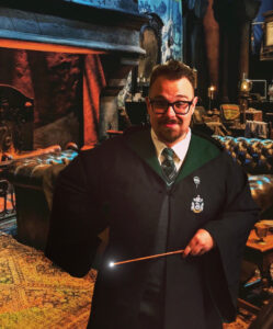 Zack in his Slytherins robe and wand. 