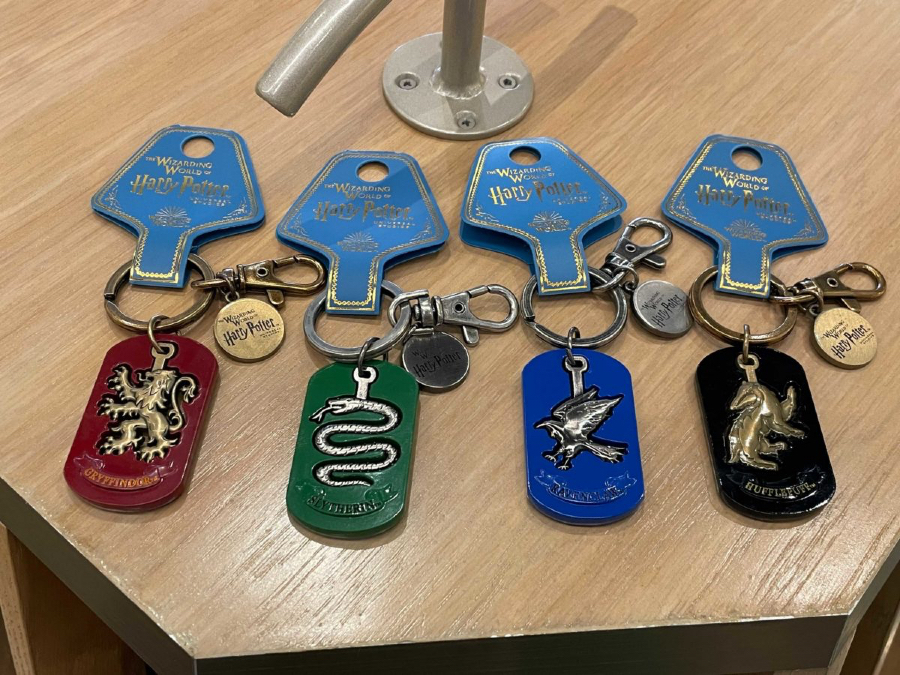 Each House keychain has its animal emerging from their tags.