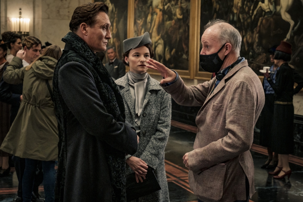 Director David Yates is shown instructing actors on the set of “Fantastic Beasts: The Secrets of Dumbledore.”