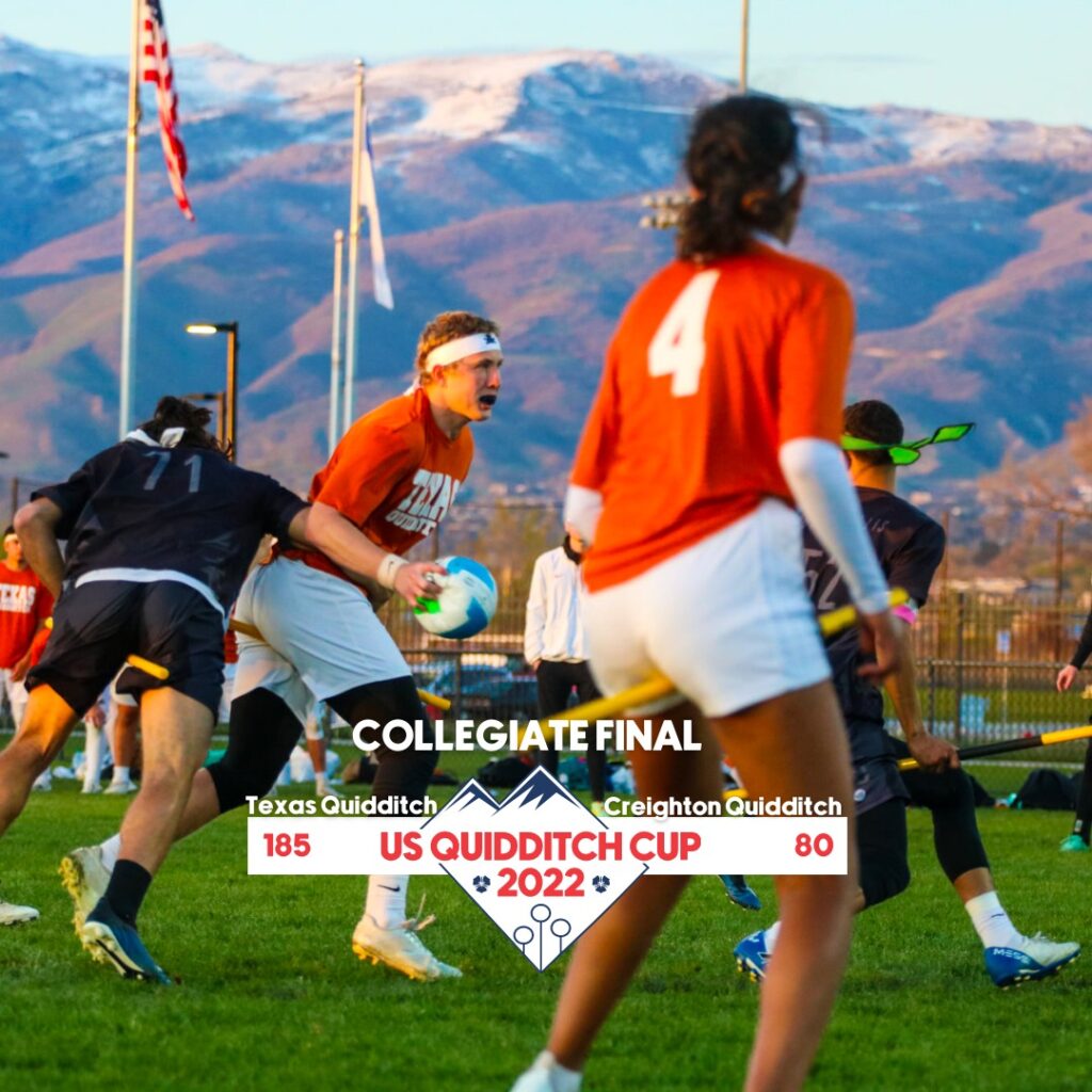 There are two chasers in orange jerseys. One of them is holding a quaffle, and a chaser from the opponent's team is trying to tackle him. The logo of US Quidditch Cup 2022 and the score of the collegiate final is overlaid.