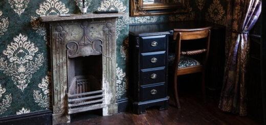 A photo of the study area of a "Harry Potter"-styled Airbnb is shown and includes a fireplace.