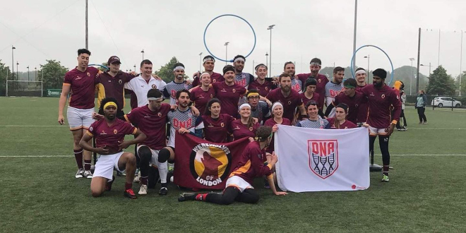 A group photo of DNA Quidditch Club shows the quidditch team in red jerseys.