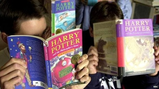 Kids reading "Harry Potter" books.