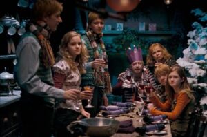 Christmas drinks being shared amongst the Weasley family and Hermione.