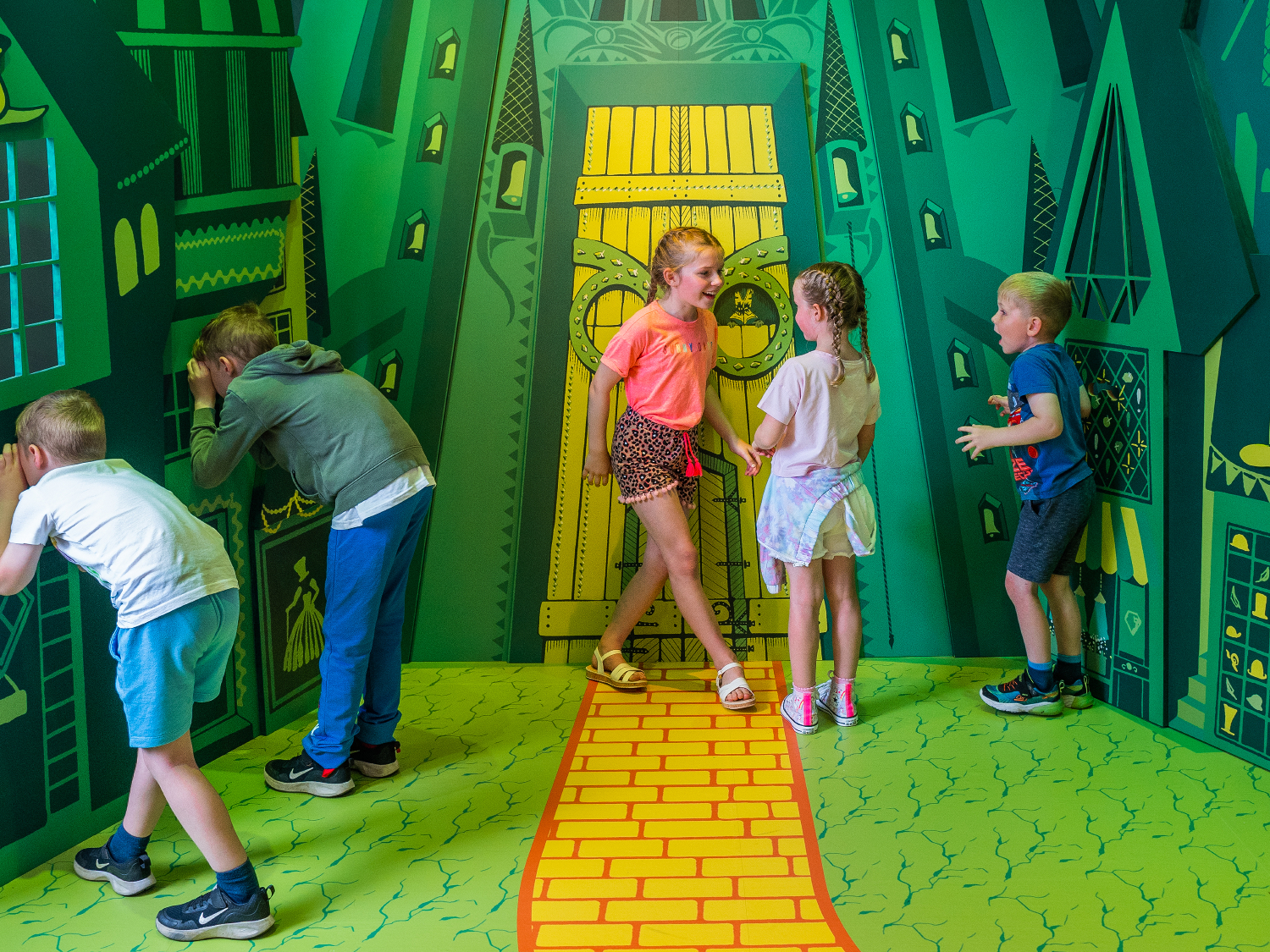 Children play at the “Wizard of Oz” exhibit at “Enchanted Journeys.” (Source: MinaLima)