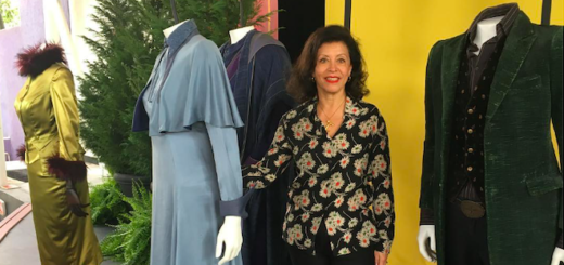 Wizarding World costume designer, Jany Temime, poses with costumes in Florida.