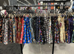 A rack of fandom themed skirts displayed at NYCC 2022.