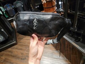A belt bag featuring the Dark Mark emblem available at Universal Studios Hollywood