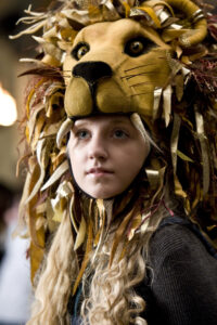 Luna Lovegood posing in her lion hat