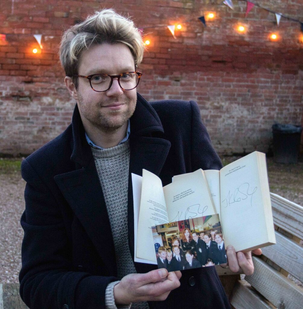 Jim Spencer with the signed "Harry Potter" books (Credit: Emma Errington/Hansons Auctioneers)