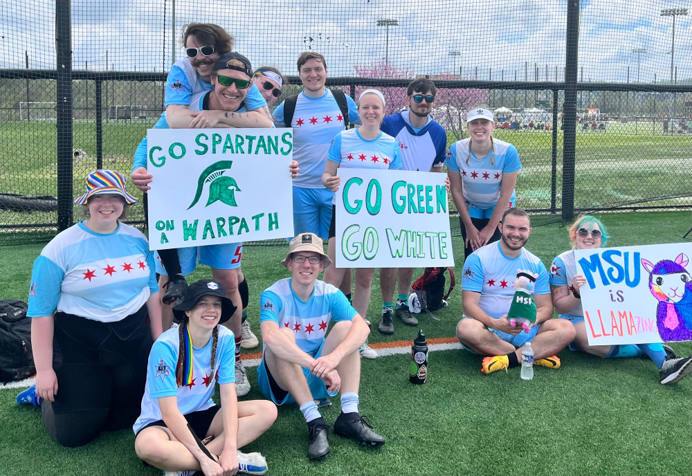 Members of Chicago United show signs in support of Michigan State University at USQ Cup 2023.