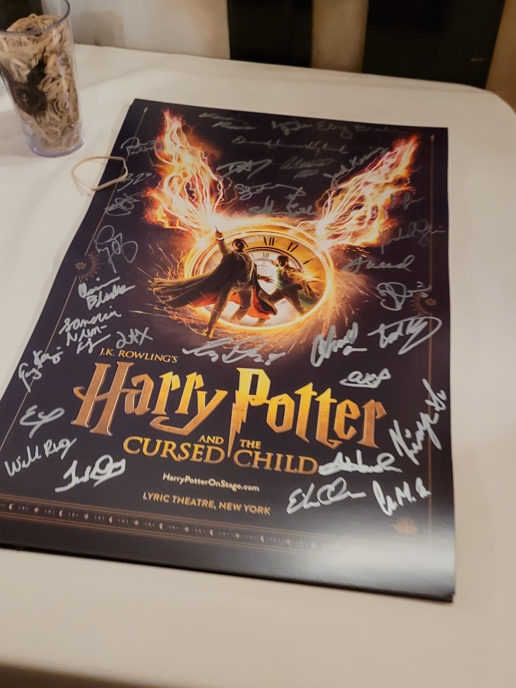 A poster features the autographs of the cast. (Credit: Kelly Komar)