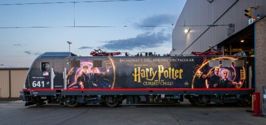 An Amtrak locomotive is pictured sporting a "Cursed Child" on Broadway train wrap.