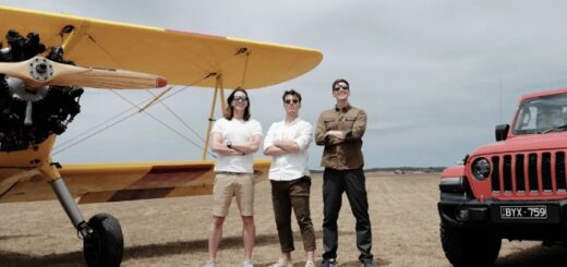 James and Oliver Phelps pose with Corey Mylchreest beside a biplane during the filming of "Fantastic Friends."