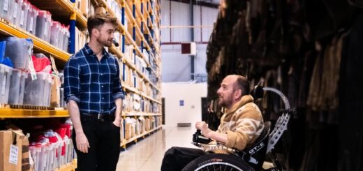 Daniel Radcliffe and David Holmes are pictured together in a warehouse.
