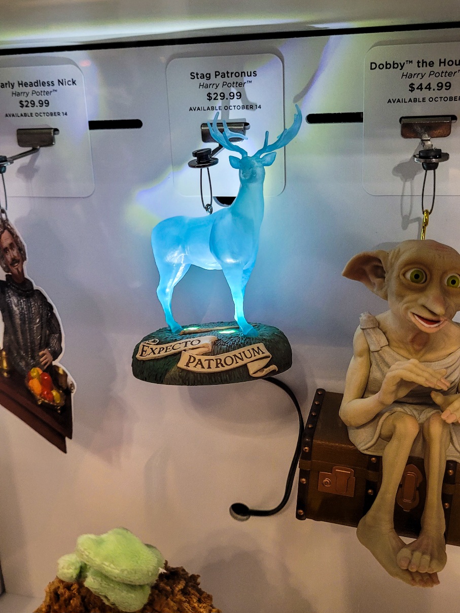 Nearly Headless Nick ornament, light-up stag Patronus ornament, and Dobby ornament