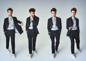 Daniel Radcliffe in a patterned suit and graphic button up for "As If" magazine