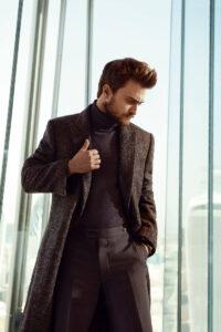 Picture of Daniel Radcliffe for InStyle Russia. He is wearing a jacket, paired with a turtleneck, and hair styled in a quiff