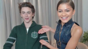 Timothée Chalamet and Zendaya in an interview for “Dune”. Timothée wears a Slytherin jumper while Zendaya points to the Slytherin badge.