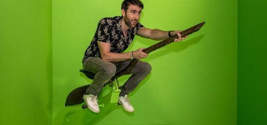 Matthew Lewis on broomstick surrounded by green screen